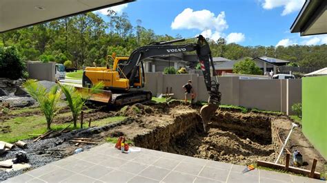 digging a pool with a mini